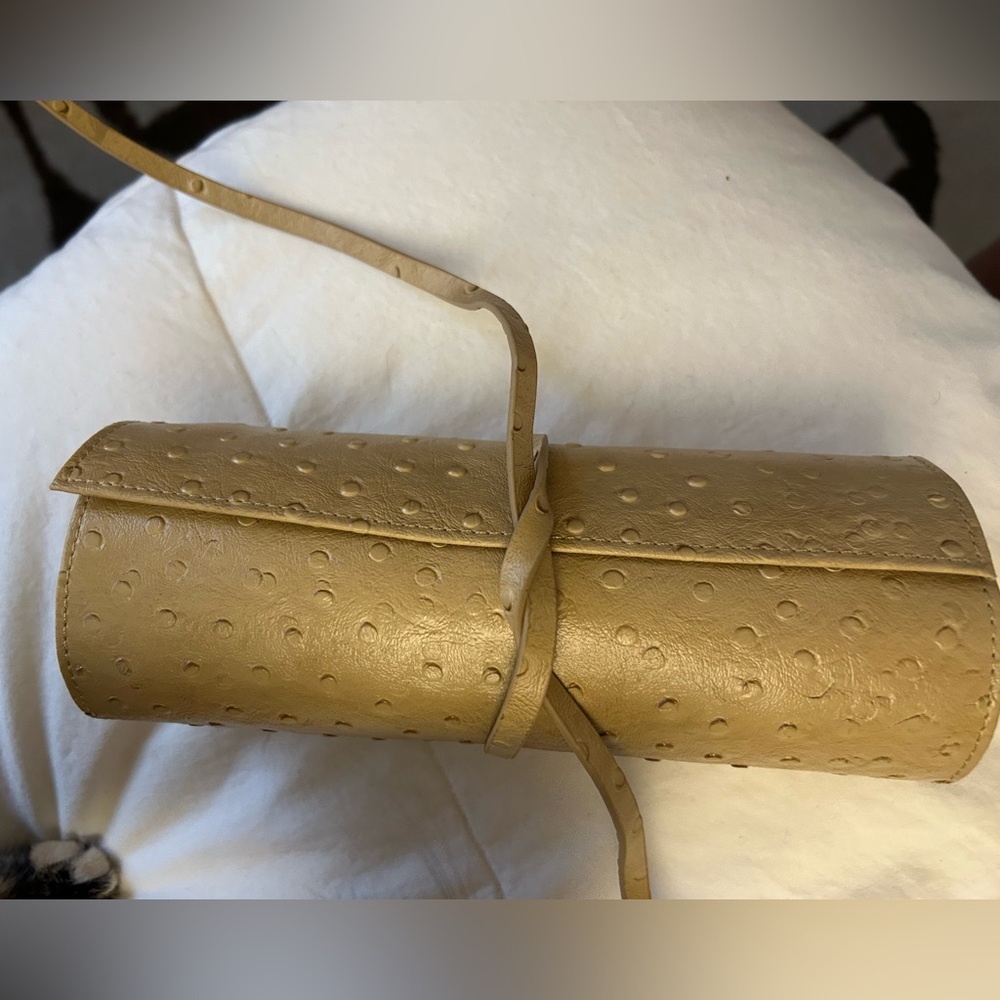 Tan pebbled-leather jewelry roll. NWOT, great for travel!